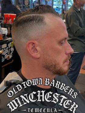 Side part with high fade by Nate at Old Town Barbers Winchester